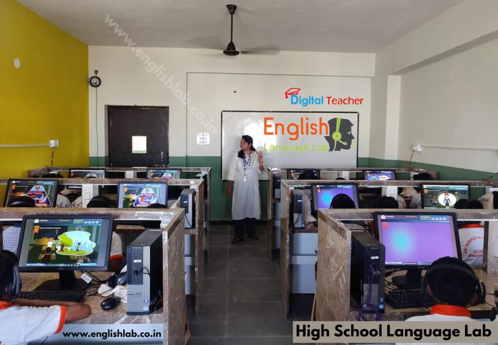Students sit at computer equipment in an English language laboratory, with a large screen showing the 'English Language Lab' and a teacher nearby.